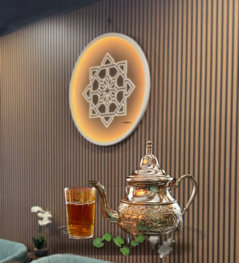 Moroccan mint tea poured from a traditional kettle